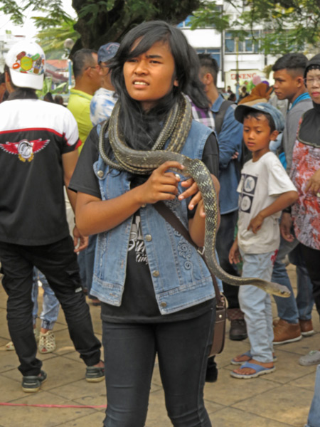 A young lady channels Alice Cooper in front of the clocktower in Bukittinggi, Sumatra, Indonesia.