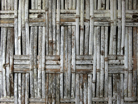 A close-up of a thatched wooden wall on a traditional Minangkabau house in Rao Rao near Bukittinggi, Sumatra, Indonesia.