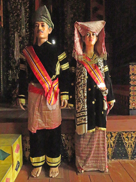 A display of traditional Minangkabau costumes in Pagarayung Palace near Batu Sangkar, Sumatra, Indonesia.