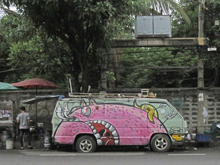A painted-up van on Soi Thong Lor in Sukhumvit, Bangkok, Thailand.