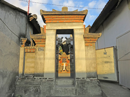 A family compound gate on Jalon Raya Cokorda Gede Rai in Peliatan, Bali, Indonesia.