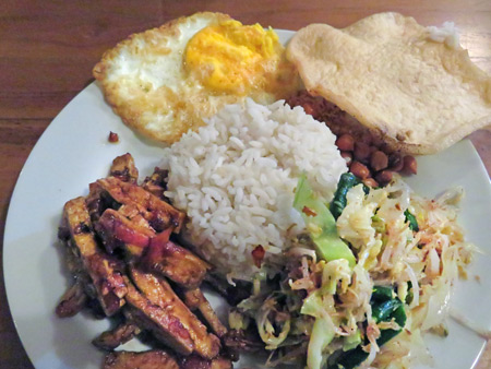 Nasi Campur at a guesthouse warung in Ubud, Bali, Indonesia.