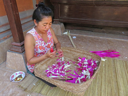 Ketut makes some Hindu offerings at the Arjuna 3 Guesthouse in Ubud, Bali, Indonesia.