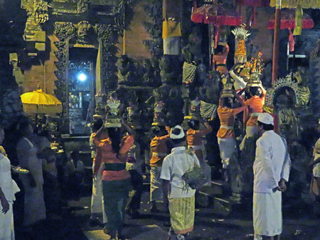 A procession at a Hindu temple ceremony at Pura Penataran Pande in Peliatan, Bali, Indonesia.