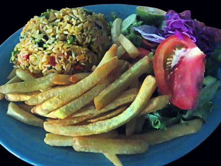 Fried rice, French fries and a salad at Restaurante Carolina in Puerto Jimenez, Costa Rica.