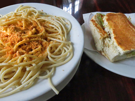 A plate of buttery spaghetti and an egg sandwich at Cafe Coca-Cola in Casco Viejo, Panama City, Panama.
