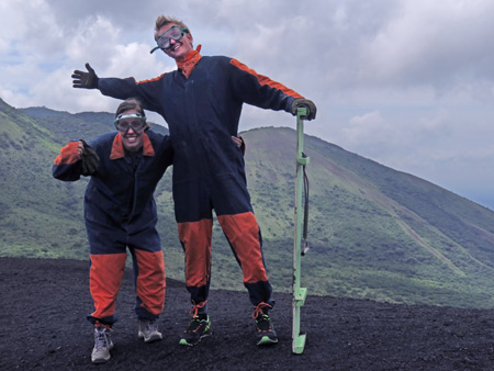 Whitley and Marius mug it up in their funky denim coveralls at the top of Cerro Negro, Nicaragua.