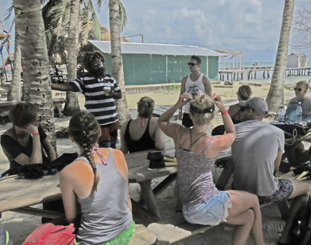 The Caveman gives a pre-snorkeling speech at Caveman Snorkeling Tours in Caye Caulker, Belize.