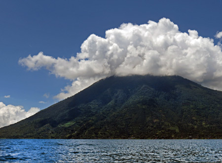 A cloud-shrouded San Pedro volcano at Lago de Atitlan, Guatemala.