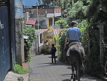 Moises leads the way on a horse ride in San Pedro, Lago de Atitlan, Guatemala.