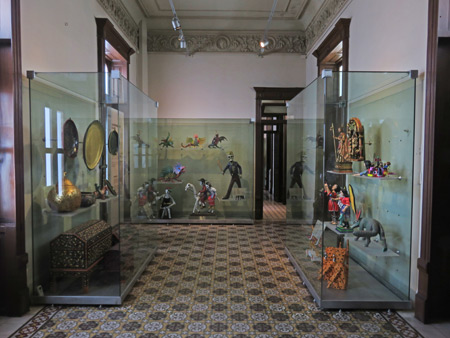 Display cases upstairs at the Museo de Arte Popular de Yucatan in Merida, Mexico.