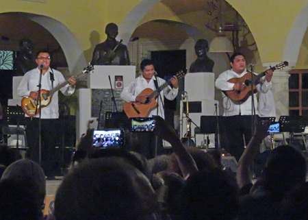 Three guitarists perform during Serenatas Yucatecas at Parque de Santa Lucía in Merida, Mexico.
