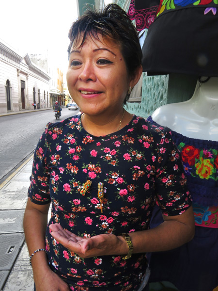 The insect broach lady in Merida, Mexico. (Notice the two insect broaches on the center of her chest.)