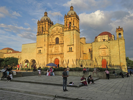 The Templo de Santo Domingo de Guzman lit up by sunset in Oaxaca City, Mexico.