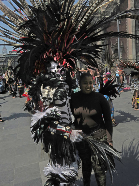 An Aztec dancer poses with a fan at the Zocalo in Mexico City, Mexico.