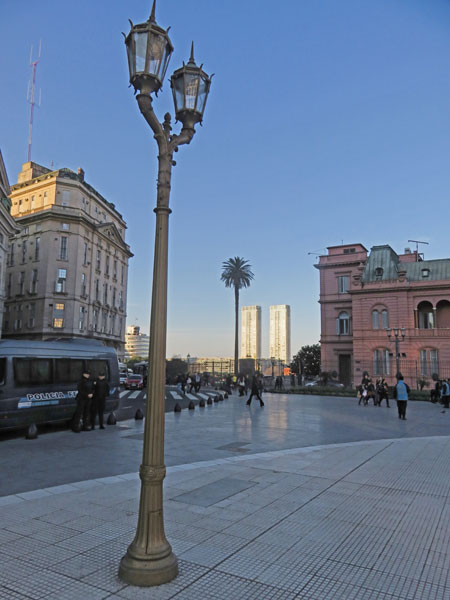 A palm tree echoes a light pole at the Plaza de Mayo in Buenos Aires, Argentina.