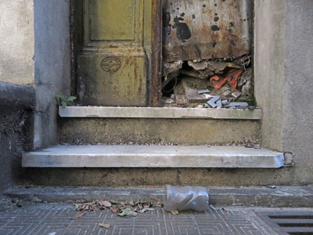 The weathered doorway of a crypt at the Cementerio de la Recoleta in Buenos Aires, Argentina.