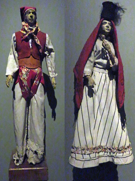 Male and female figures at the Museo del Área Fundacional in Mendoza, Argentina.