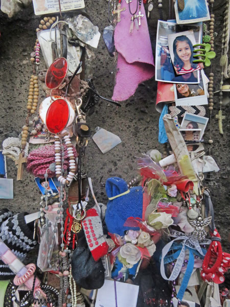 Detail of a shrine to deceased persons in front of the statue of the Virgin Mary on top of Cerro San Cristobal in Santiago, Chile.