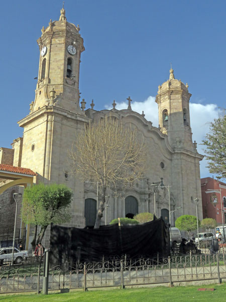 The lovely Catedral Metropolitana del Apóstol Santiago with an ugly black tarp in front of it in Potosi, Bolivia.