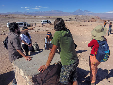 On the far left, the Lithium Aventura tour guide Alan points out some geologic features in the Valle de la Luna near San Pedro de Atacama, Chile.