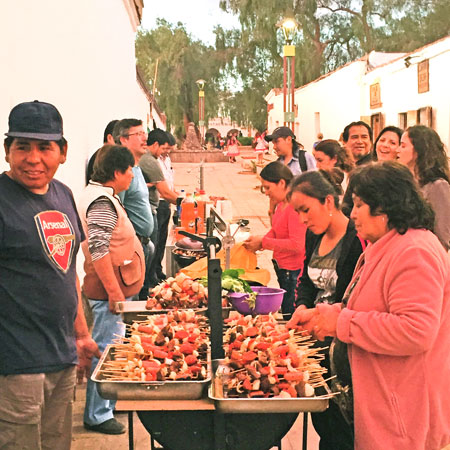 A food vendor attracts a crowd in San Pedro de Atacama, Chile.
