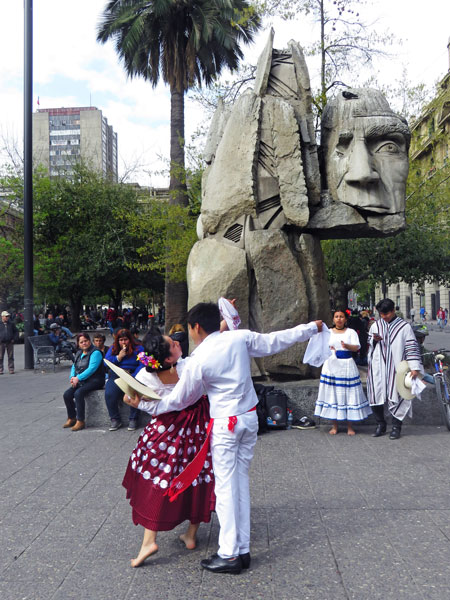 Another young couple performs a traditional Cueca dance at the Plaza de Armas in Santiago, Chile.