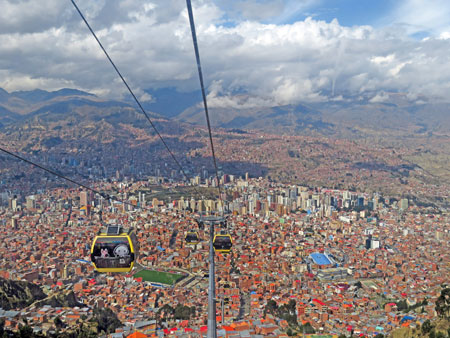 A cabin on the Mi Teleferico aerial cable car system descends from El Alto to La Paz, Bolivia.