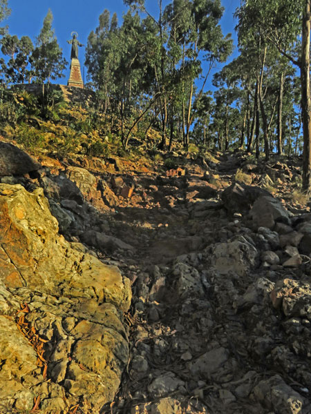 The rocky path leading up to the Cristo del Sagrado Corazón on the summit of Cerro Churuquella in Sucre, Bolivia.