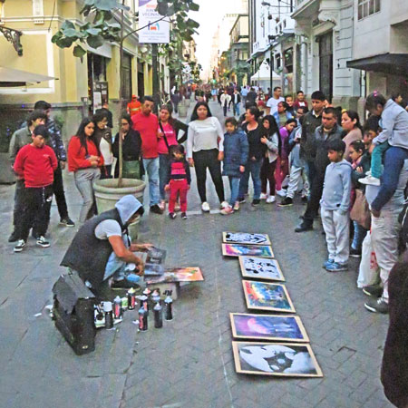 A spray paint artist who later got kicked out by the police in Lima, Peru.