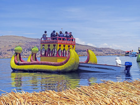 A dragon boat made out of totora reeds that shuttles tourists around the Uros Islands near Puno, Peru.